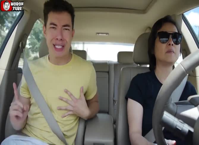Video :While his mother is driving her automobile without interruption, he dances wildly with her